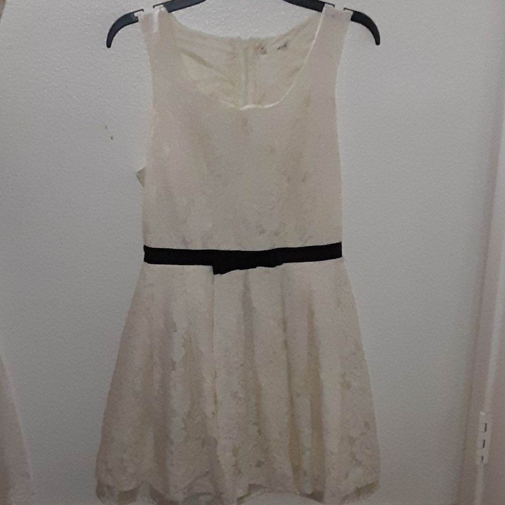 White dress with a black bow